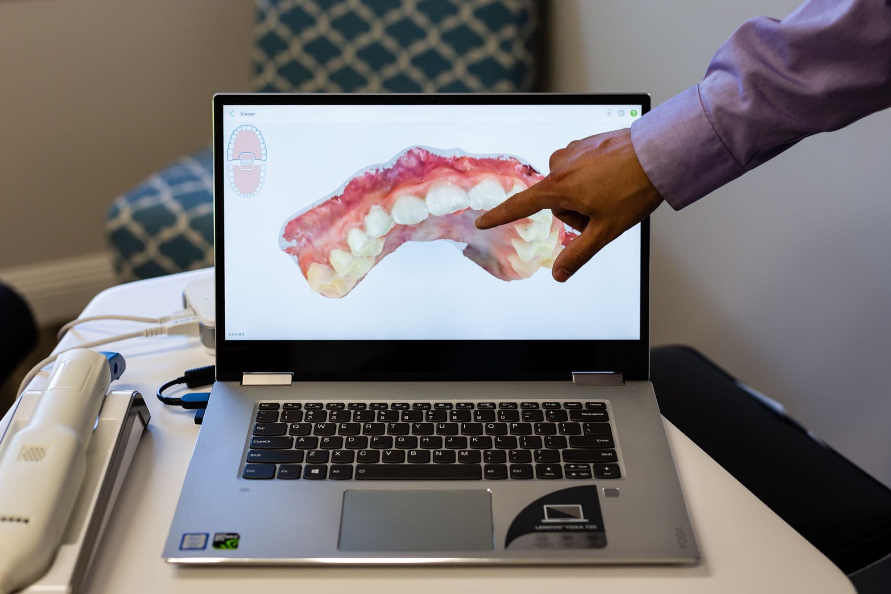 Dr. Harris pointing out a scan of a patient's teeth